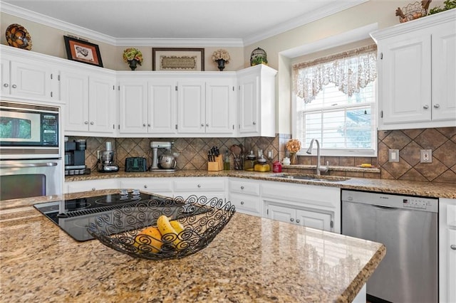 kitchen featuring sink, crown molding, stainless steel appliances, light stone countertops, and white cabinets