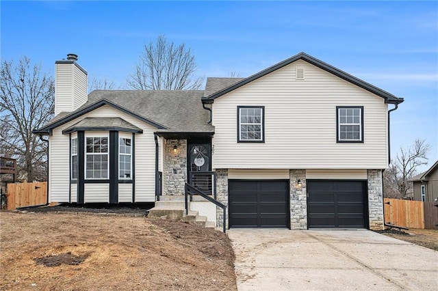 split level home featuring a garage