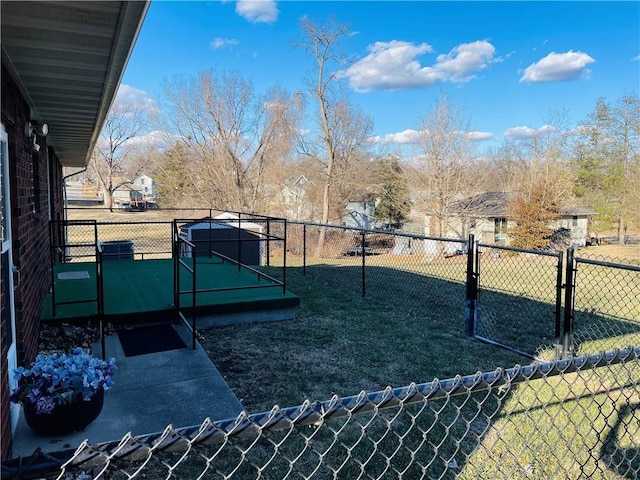 view of yard featuring fence and a gate