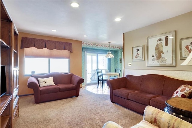 living area with recessed lighting and light colored carpet