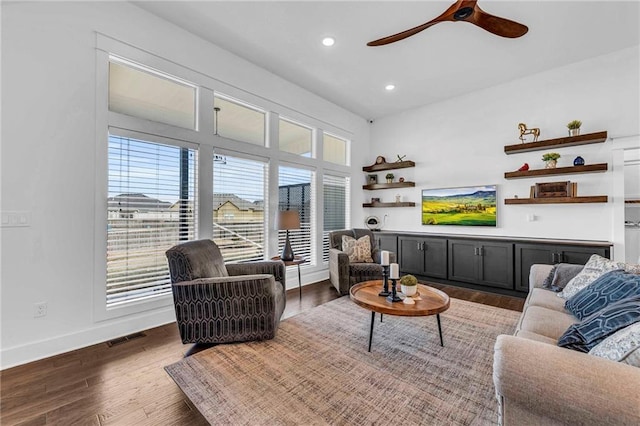 living area featuring recessed lighting, visible vents, dark wood-type flooring, a ceiling fan, and baseboards