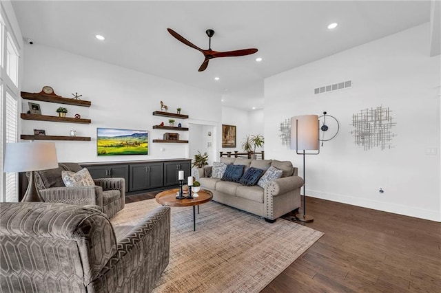 living area featuring recessed lighting, a ceiling fan, baseboards, visible vents, and dark wood finished floors