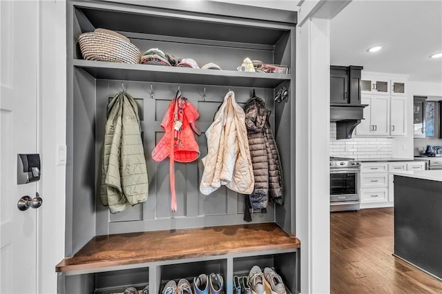 mudroom with dark wood-type flooring and recessed lighting