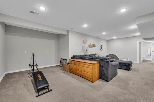 carpeted living room with recessed lighting, visible vents, and baseboards