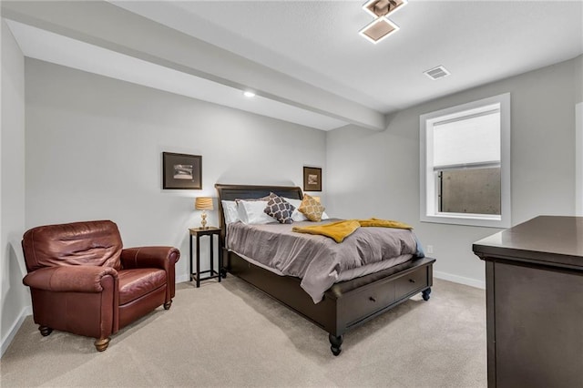 bedroom featuring baseboards, visible vents, and light colored carpet