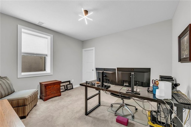 office area with light colored carpet and baseboards