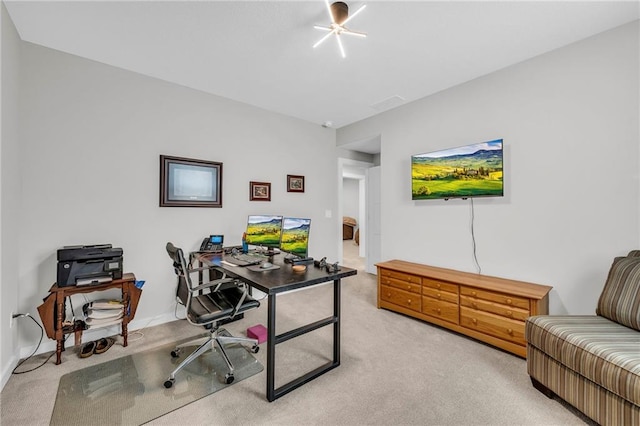 carpeted home office featuring baseboards