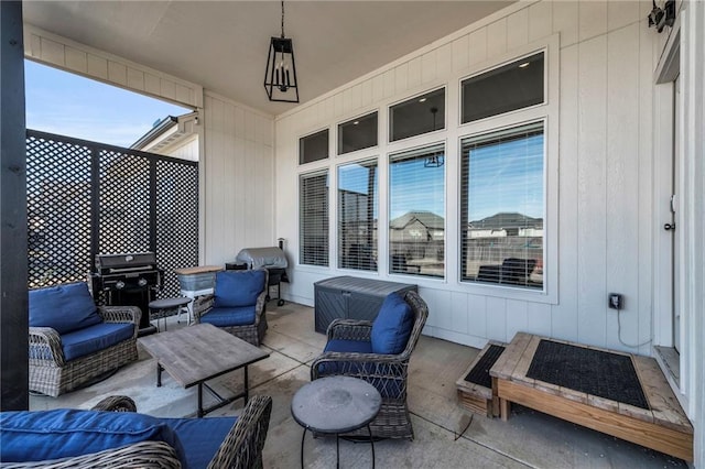 view of patio with grilling area and outdoor lounge area