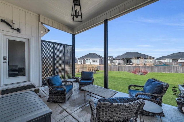 view of patio with entry steps, fence private yard, and a residential view