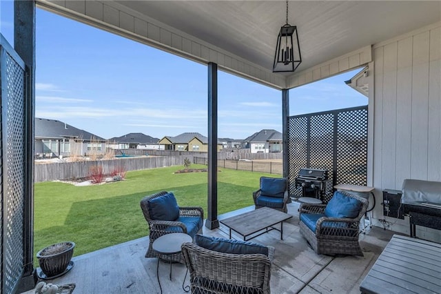 sunroom featuring a residential view