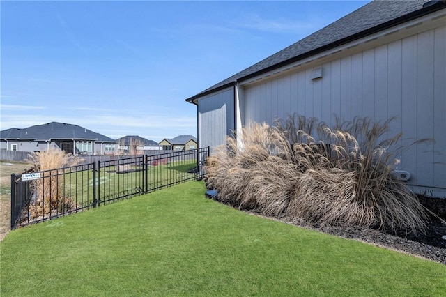 view of yard with fence and a residential view