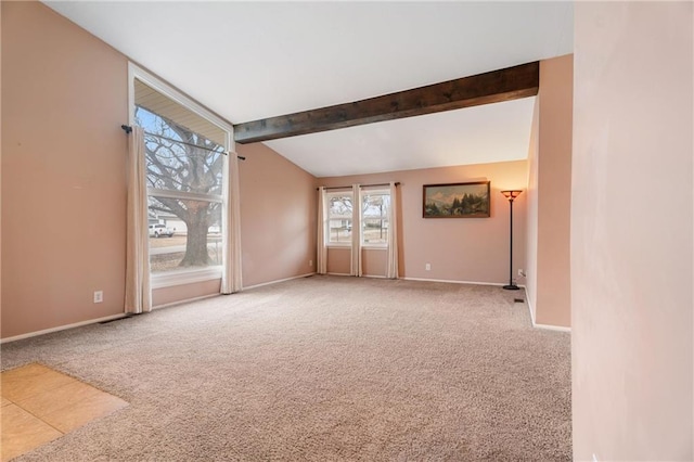 carpeted empty room with vaulted ceiling with beams