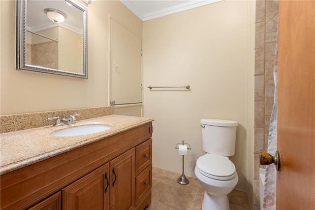 bathroom featuring tile patterned flooring, vanity, ornamental molding, and toilet