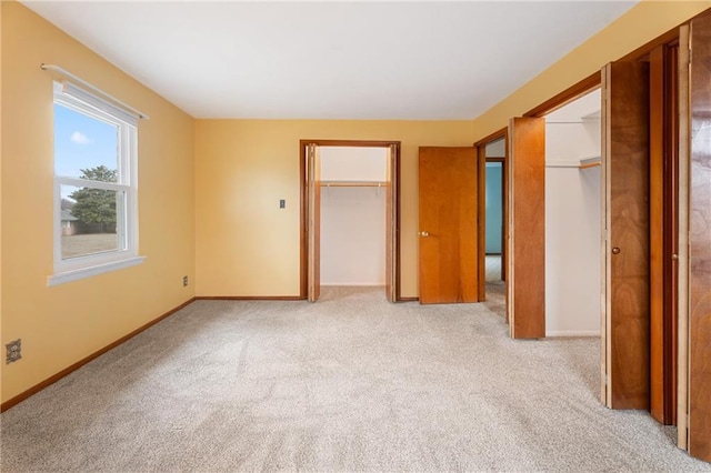 unfurnished bedroom with light carpet