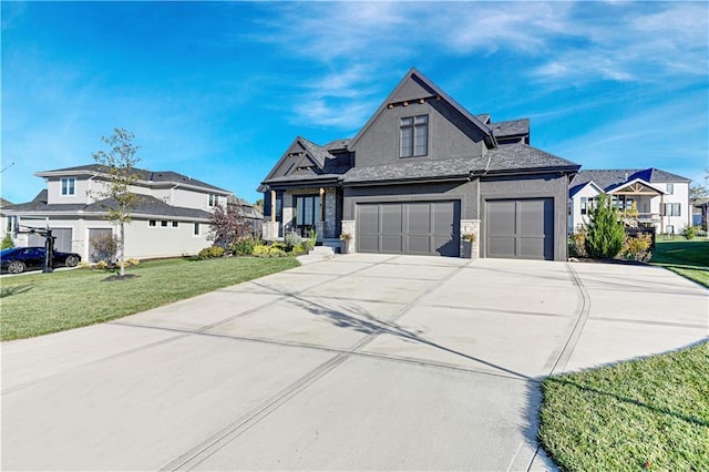 view of front of home featuring stucco siding, a garage, a residential view, driveway, and a front lawn