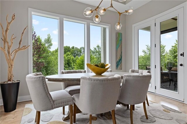 dining space featuring light wood finished floors