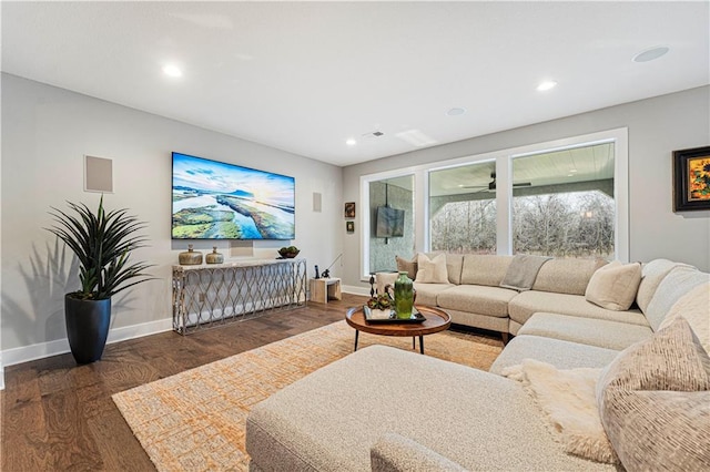 living room with recessed lighting, wood finished floors, and baseboards