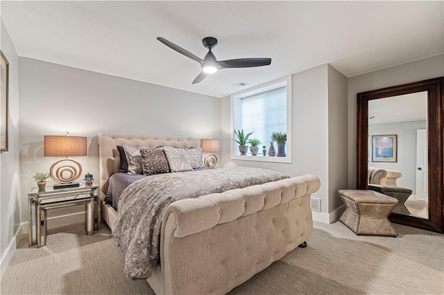 bedroom with light carpet, visible vents, ceiling fan, and baseboards