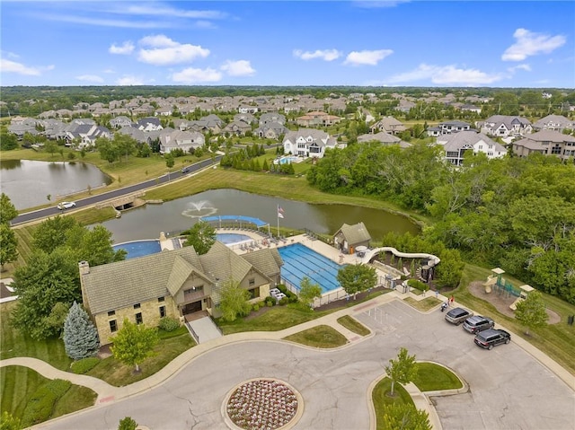 aerial view with a residential view and a water view