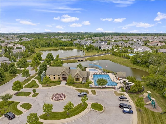 bird's eye view featuring a residential view and a water view