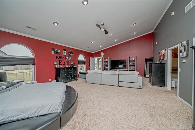 bedroom with crown molding, vaulted ceiling, and carpet