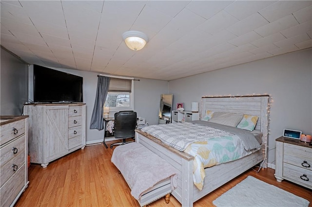 bedroom with light hardwood / wood-style floors