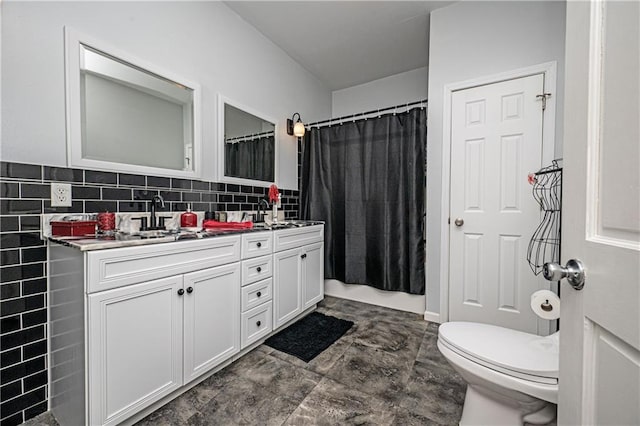 bathroom featuring vanity, toilet, a shower with shower curtain, and backsplash