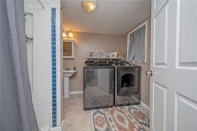 laundry room featuring washer and clothes dryer and sink