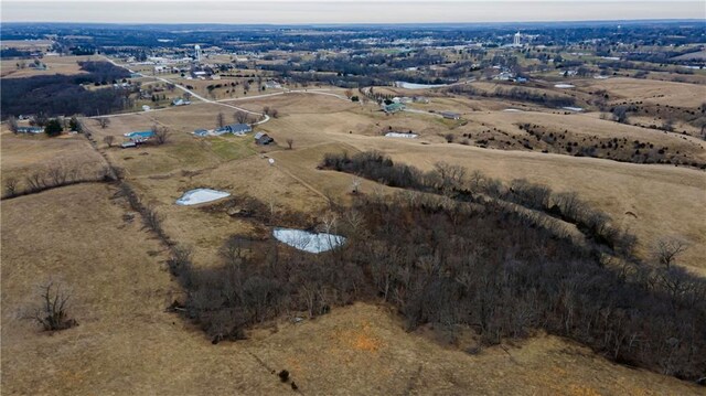 bird's eye view with a water view and a rural view