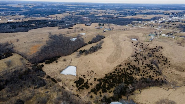 birds eye view of property featuring a rural view