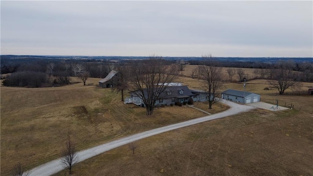 birds eye view of property with a rural view