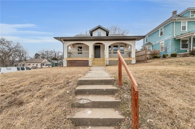 view of front facade featuring a front yard and a porch