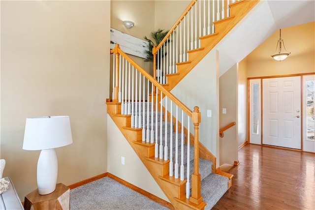 entrance foyer featuring wood finished floors and baseboards