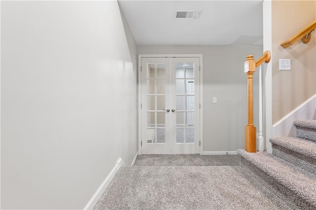 doorway to outside featuring french doors, visible vents, carpet flooring, baseboards, and stairs