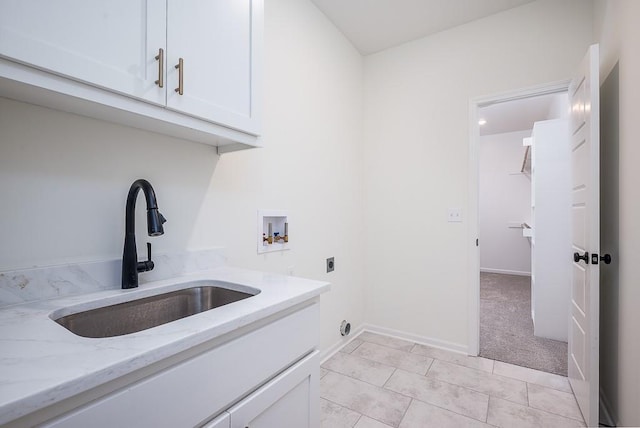 laundry room featuring sink, cabinets, light tile patterned floors, washer hookup, and hookup for an electric dryer