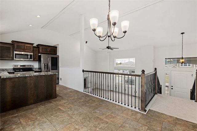 kitchen with pendant lighting, stainless steel appliances, lofted ceiling, stone countertops, and dark brown cabinetry