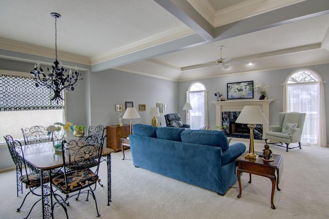 carpeted living room with beamed ceiling, a premium fireplace, crown molding, and a wealth of natural light