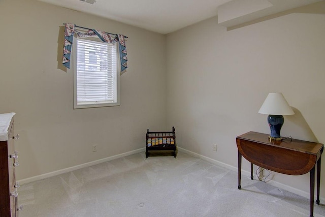 living area featuring light colored carpet