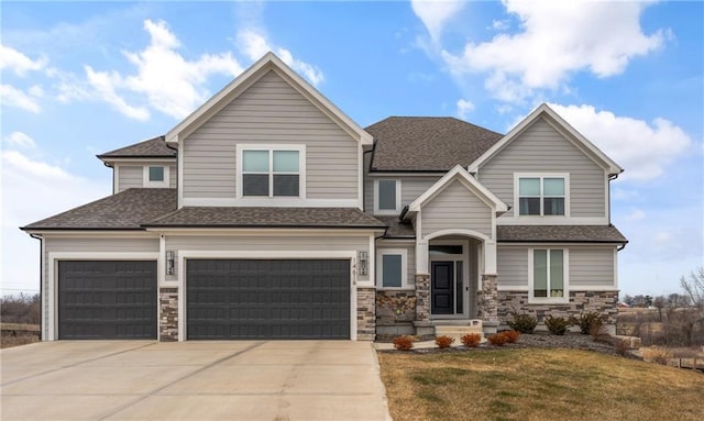 view of front of property featuring a garage, concrete driveway, stone siding, roof with shingles, and a front lawn