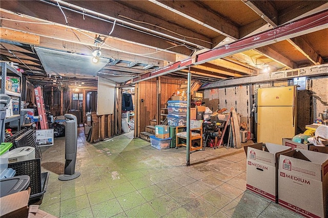 basement featuring refrigerator