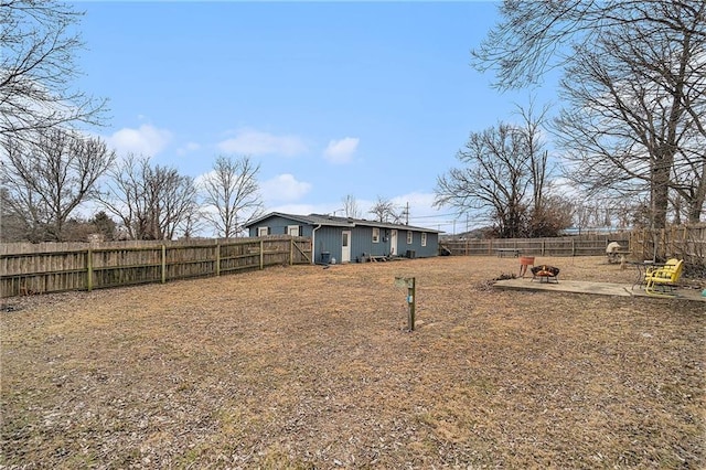 view of yard with an outdoor fire pit and a patio