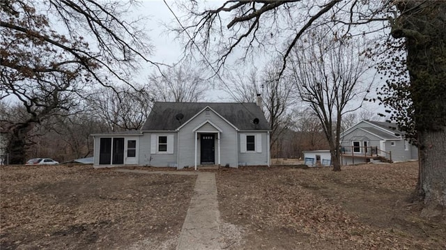 view of front of property featuring a sunroom