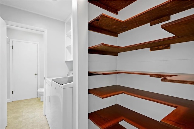 pantry featuring washer and dryer
