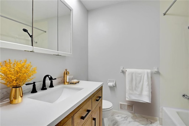 full bath with toilet, vanity, a washtub, and marble finish floor