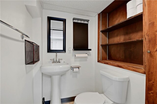 bathroom featuring toilet and a sink