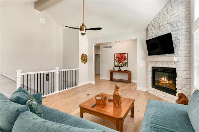 7209 Allman Dr, Shawnee, KS 66217 - living room with a fireplace, a ceiling fan, wood finished floors, high vaulted ceiling, and beamed ceiling