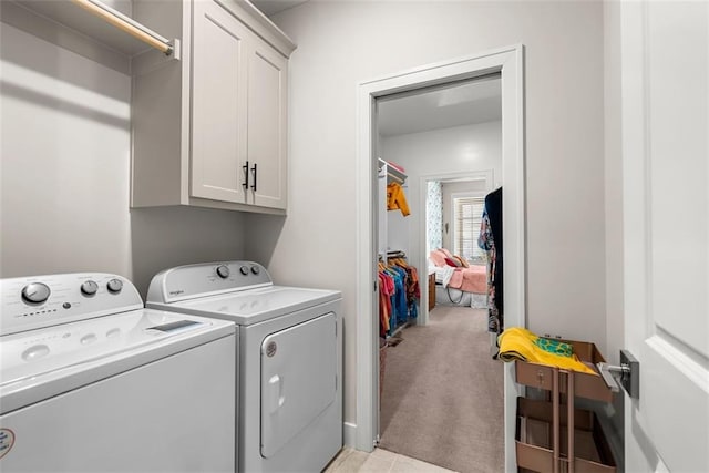 7209 Allman Dr, Shawnee, KS 66217 - laundry area featuring cabinet space, washing machine and dryer, and light colored carpet