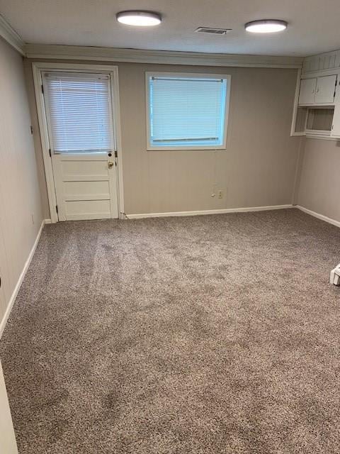 unfurnished room with carpet floors and ornamental molding