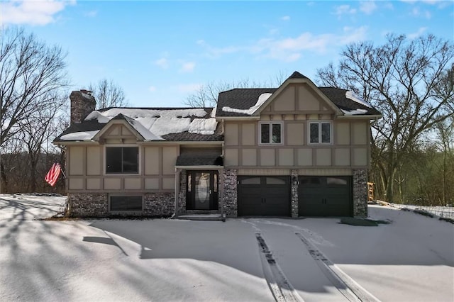 tudor-style house with a garage