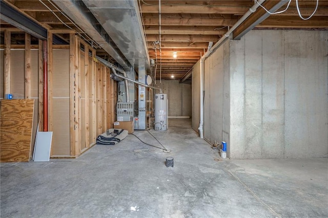 unfinished basement with gas water heater and heating unit